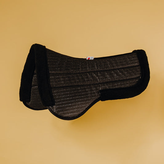 The Secure half pad is a hypo-allergenic non-slip half pad made with 1/2″ inch high-resiliency foam. It absorbs shock and moves impact laterally, protecting the horse’s back. The non-slip surface will keep your saddle in place without having to put extra